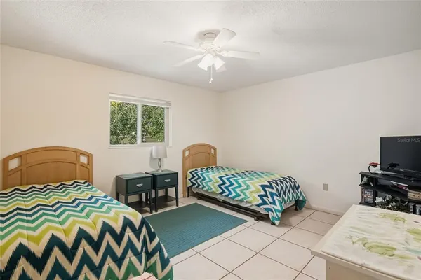 a bedroom with a bed and a table in it