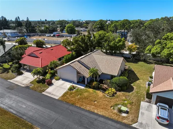 an aerial view of houses with yard