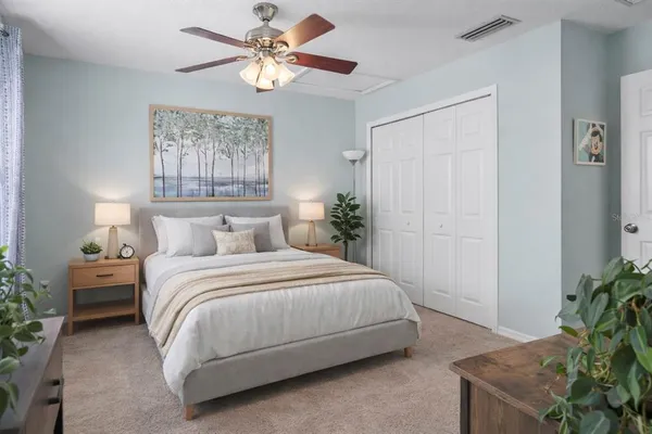 a bedroom with a bed and a chandelier