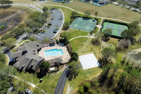 an aerial view of a house with outdoor space
