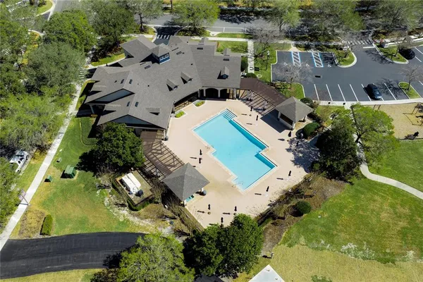 an aerial view of a house with a swimming pool