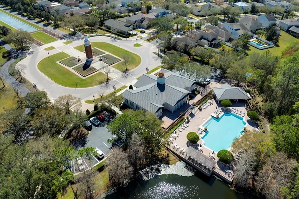an aerial view of a house with a swimming pool