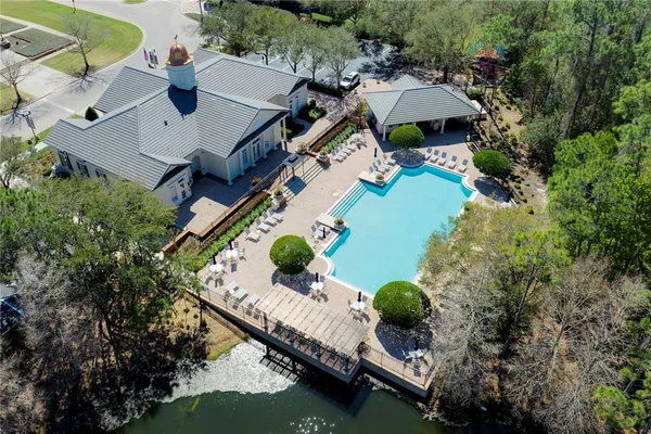 an aerial view of house with yard swimming pool and outdoor seating