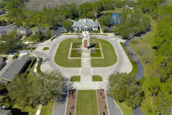 an aerial view of residential house with outdoor space and swimming pool