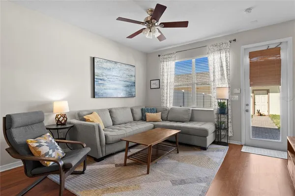 a living room with furniture and a window