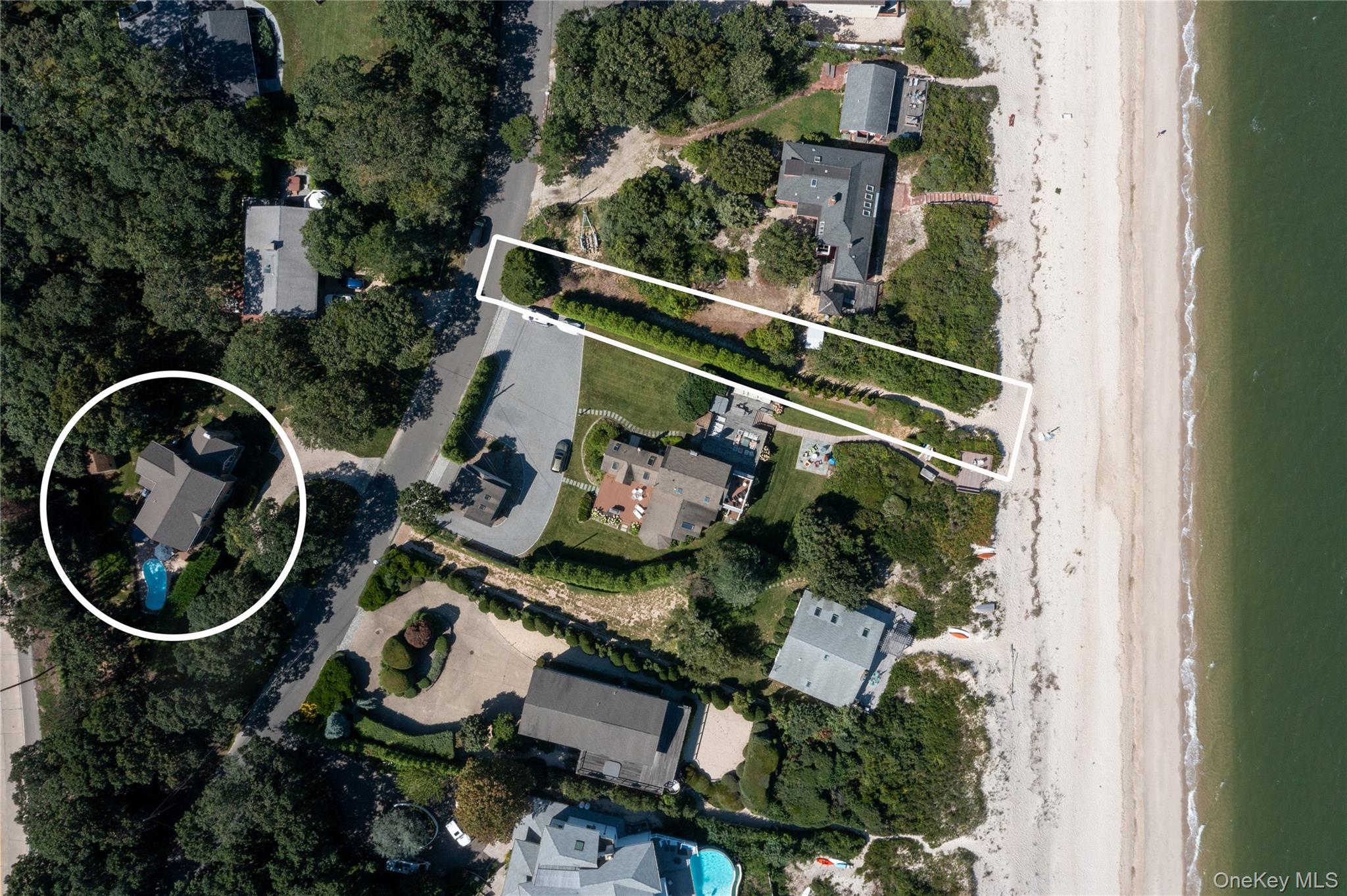 48 Oakhurst Road Hampton Bays, NY 11946 - Photo 24 of 25 an aerial view of a house with swimming pool and garden