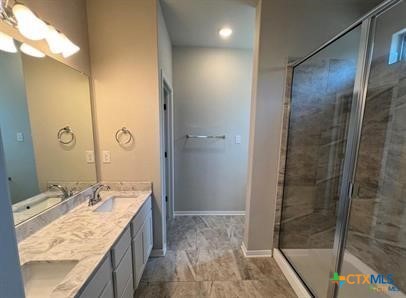 978 Aurora Grv Bend Temple, TX 76502 - Photo 6 of 10 a bathroom with a granite countertop sink a mirror and shower