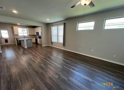 978 Aurora Grv Bend Temple, TX 76502 - Photo 9 of 10 an empty room with wooden floor and windows