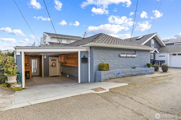a view of a house with a patio and a garage