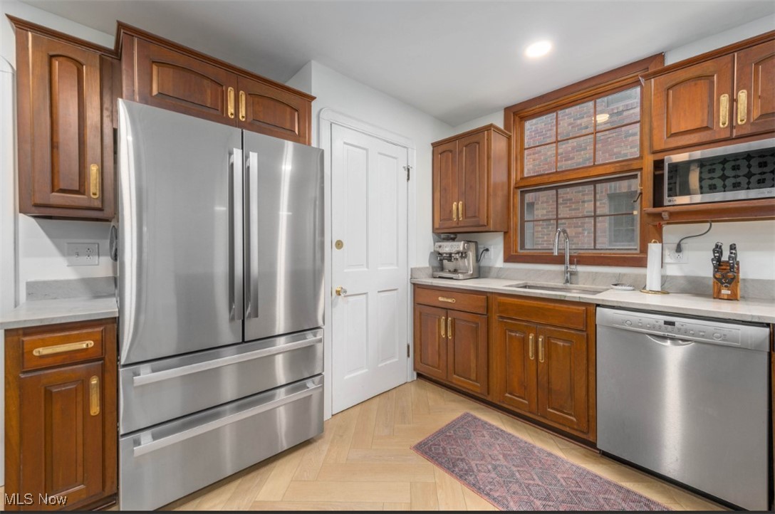 15500 Greenway Road Cleveland, OH 44111 - Photo 14 of 36 Kitchen with appliances with stainless steel finishes and brown cabinets