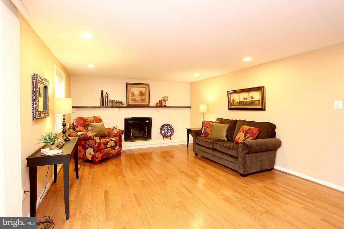 10633 Seneca Spring Way Gaithersburg, MD 20886 - Photo 19 of 30 Family Room with a burning wood fireplace