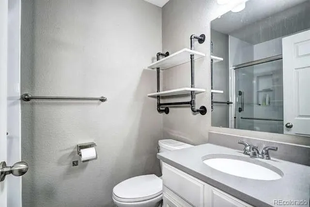 a bedroom with a large bed and window