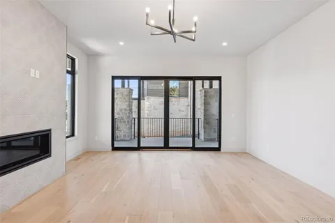 a view of an empty room with glass door