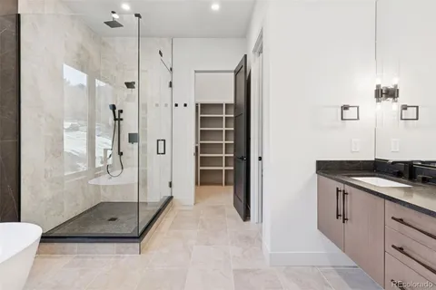 a bathroom with a tub and shower