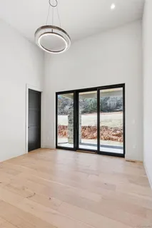 a view of an empty room with windows