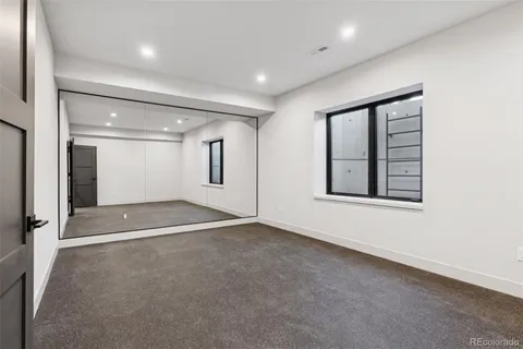 a bathroom with a shower sink and mirror