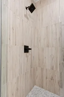 a view of a kitchen with white cabinets