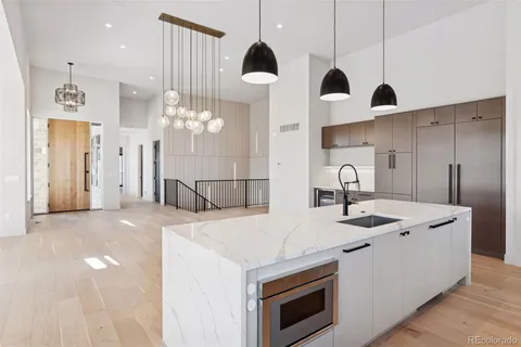 a stove top oven sitting inside of a kitchen