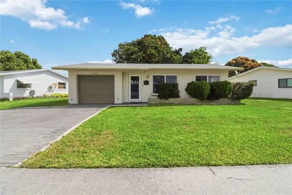 a house view with a garden space