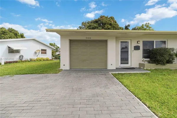 front view of a house with a yard