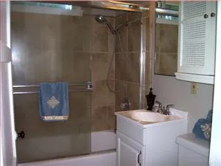 a bathroom with a sink and mirror