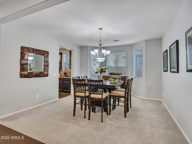 a large kitchen with stainless steel appliances granite countertop plenty wooden cabinets counter space a sink and a center island