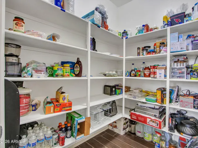 a kitchen with granite countertop stainless steel appliances and wooden cabinets