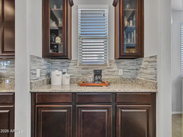 a kitchen with granite countertop stainless steel appliances and cabinets
