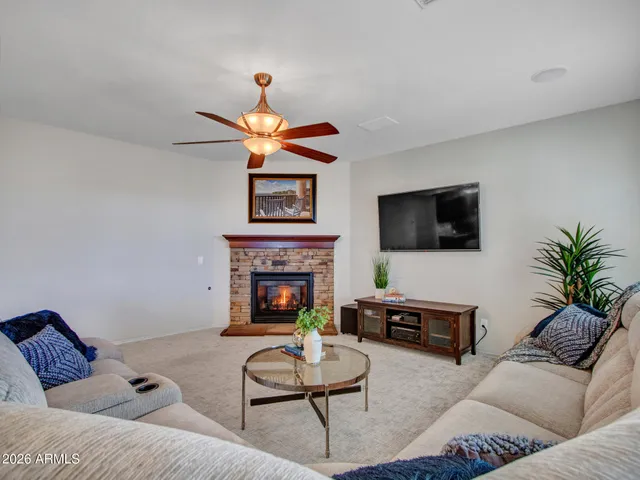 swimming pool view with a seating space and a garden view