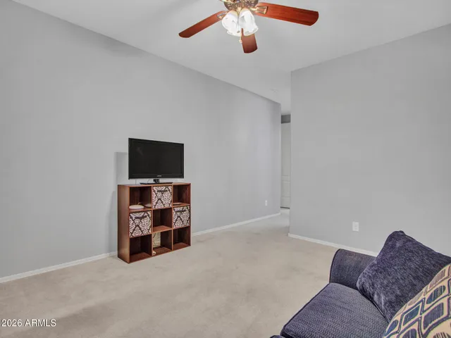 a bed room with a bed and a chandelier