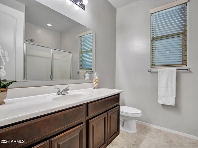 a bedroom with a large bed and a dresser