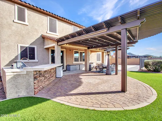 a bedroom with two beds and a chandelier