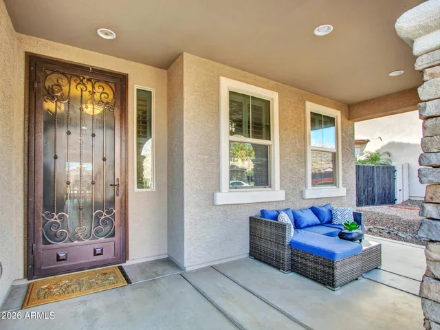 a view of a room with wooden floor and windows