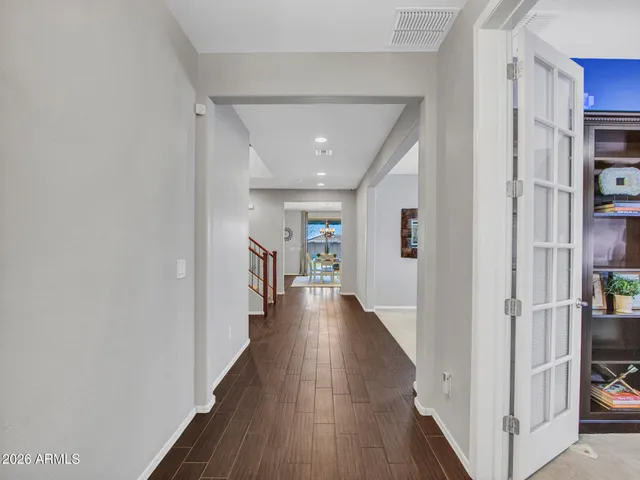 a work room with furniture and a chandelier