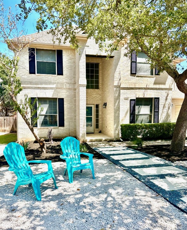 a front view of a house with patio