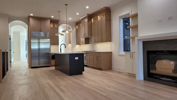 a kitchen with a sink and stove
