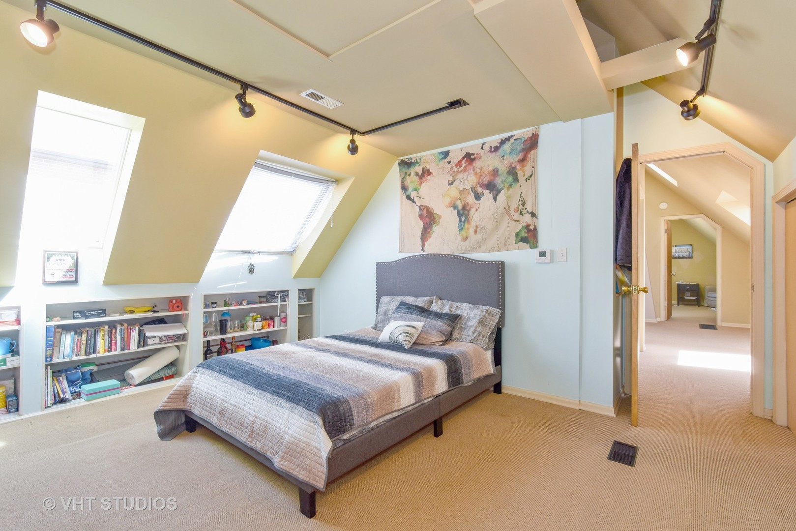 1424 West Fletcher Street Chicago, IL 60657 - Photo 11 of 24 a bedroom with a bed and a book shelf