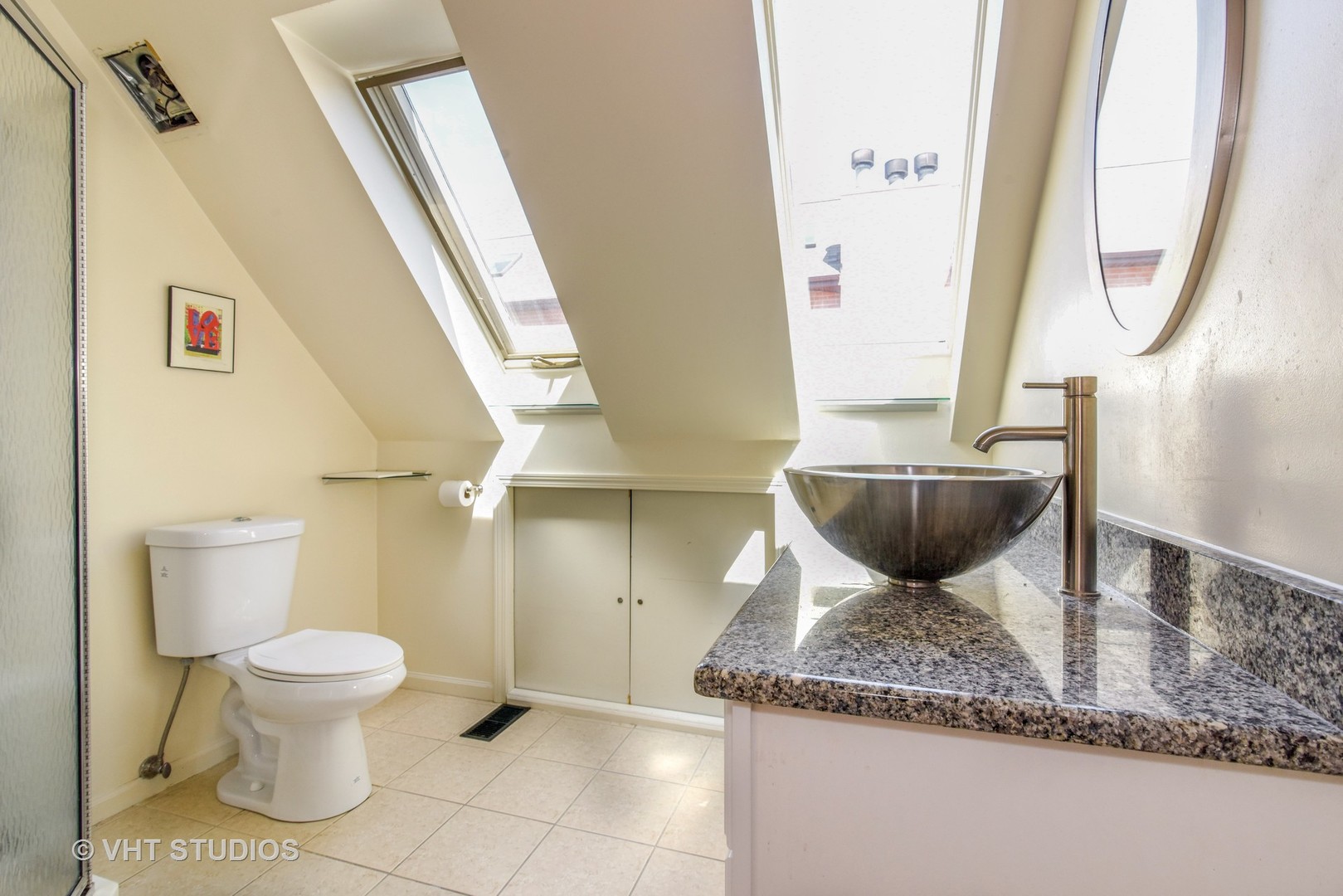 1424 West Fletcher Street Chicago, IL 60657 - Photo 12 of 24 a bathroom with a granite countertop sink and a mirror