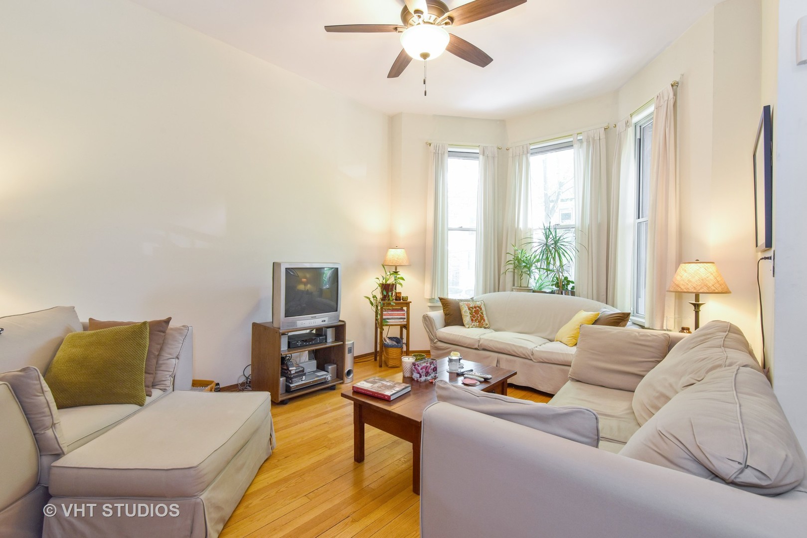 1424 West Fletcher Street Chicago, IL 60657 - Photo 13 of 24 a living room with furniture and a flat screen tv