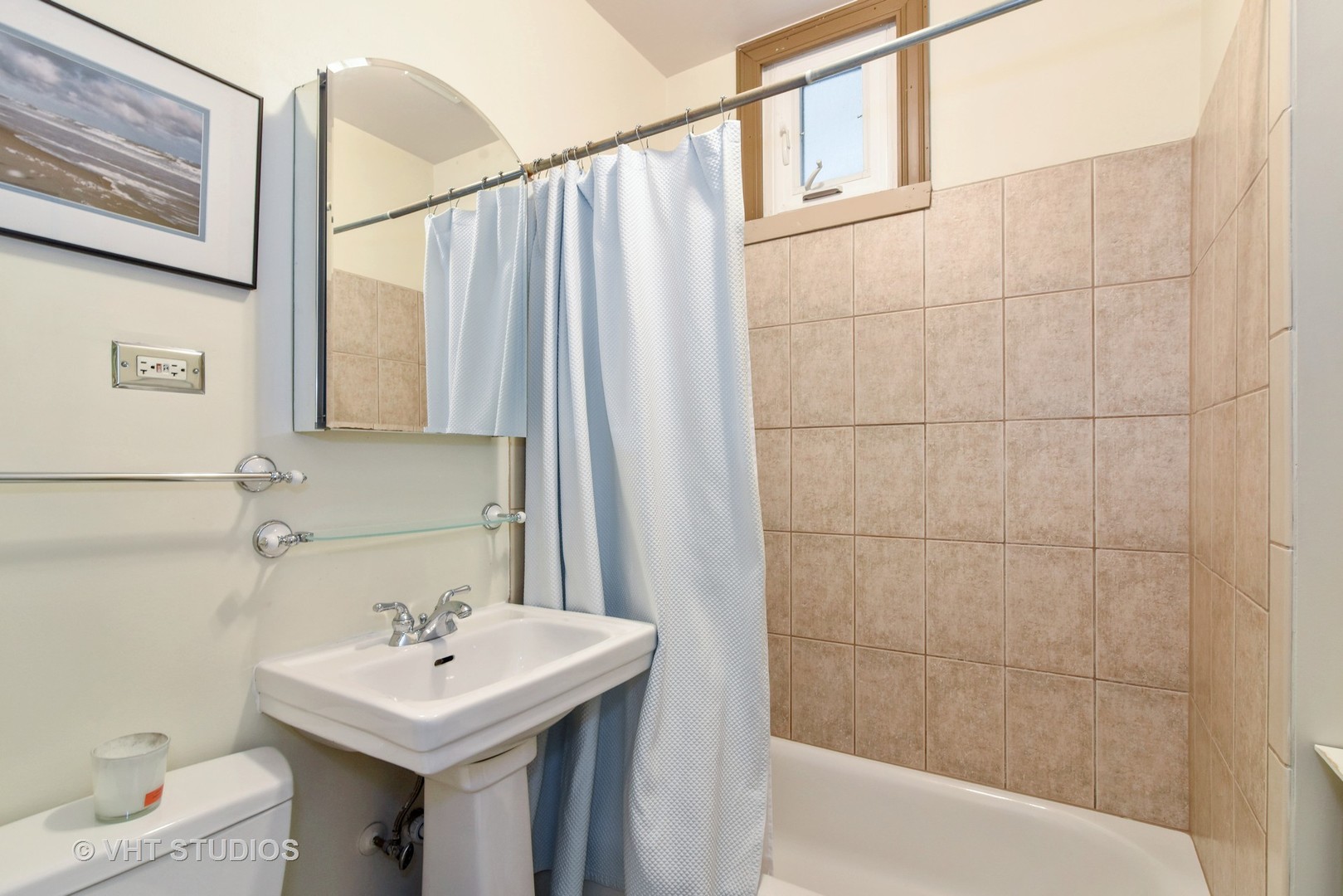 1424 West Fletcher Street Chicago, IL 60657 - Photo 17 of 24 a bathroom with a sink toilet and shower