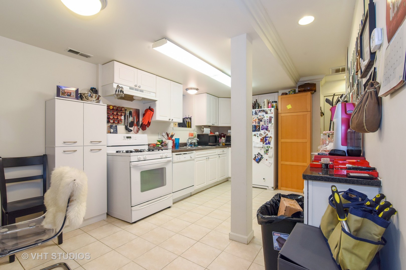 1424 West Fletcher Street Chicago, IL 60657 - Photo 21 of 24 a kitchen with refrigerator and cabinets
