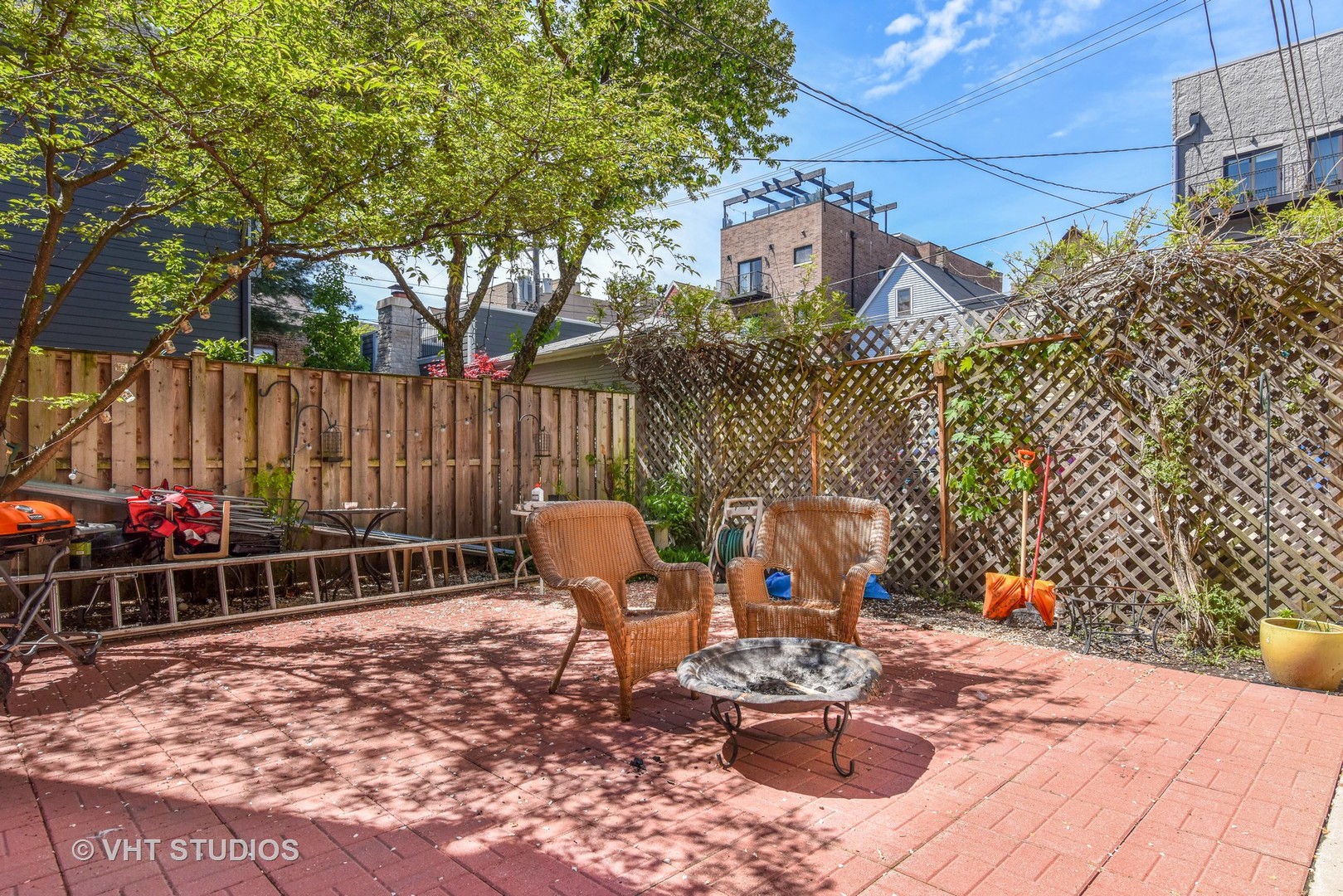 1424 West Fletcher Street Chicago, IL 60657 - Photo 24 of 24 a backyard of a house with table and chairs