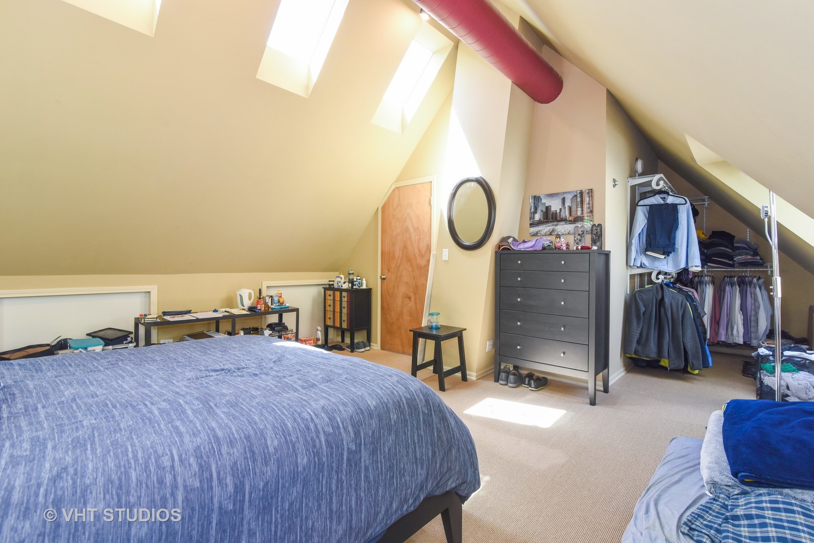 1424 West Fletcher Street Chicago, IL 60657 - Photo 8 of 24 a bed room with a bed and a closet