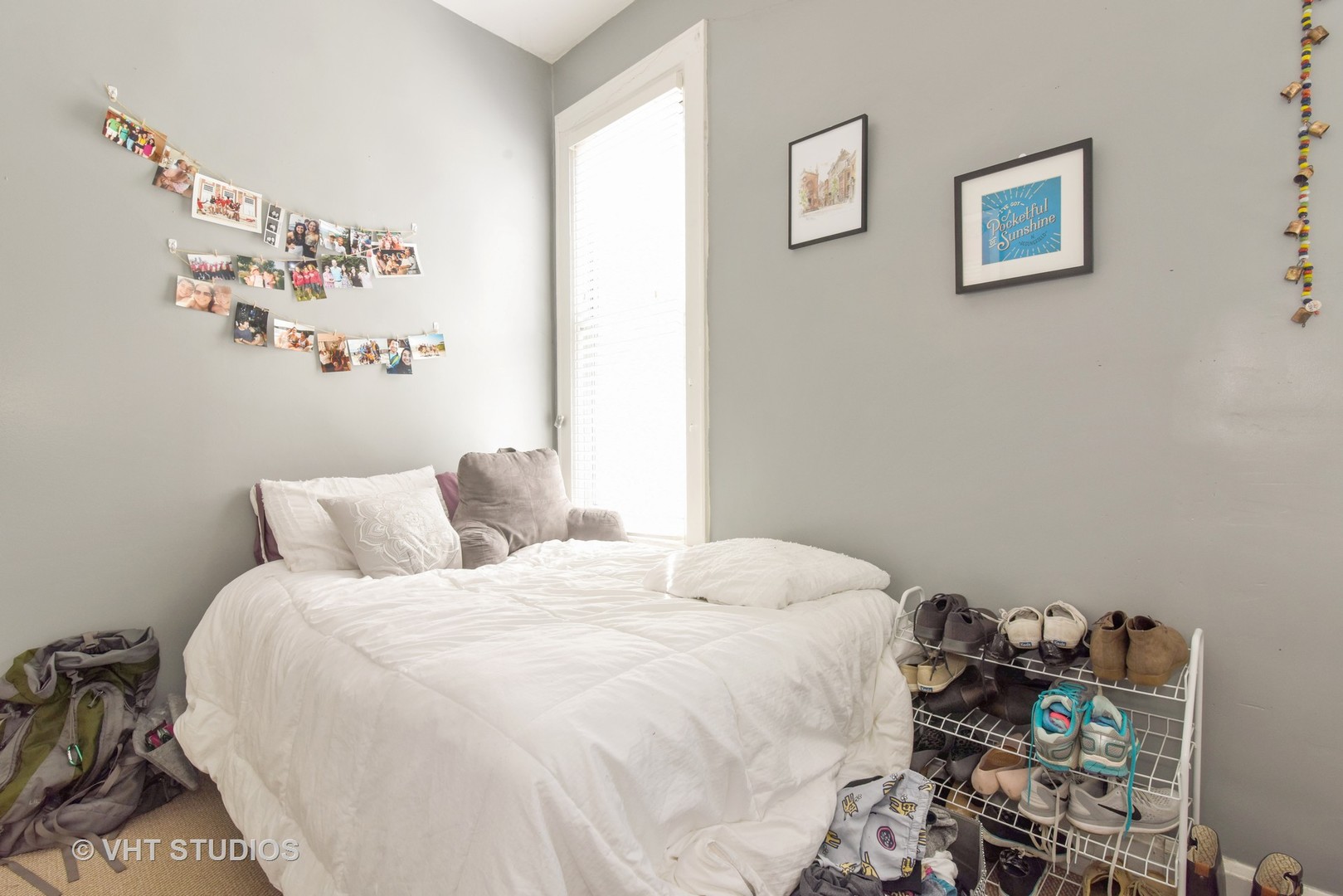 1424 West Fletcher Street Chicago, IL 60657 - Photo 9 of 24 a bedroom with a bed and a wall painting