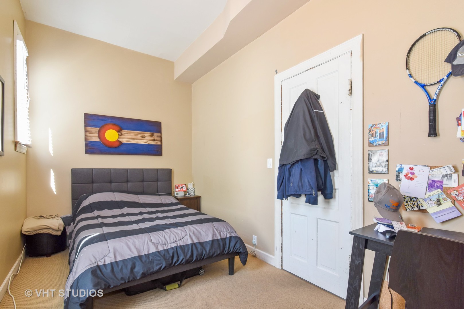 1424 West Fletcher Street Chicago, IL 60657 - Photo 10 of 24 a bedroom with a bed and a flat tv screen on the dresser