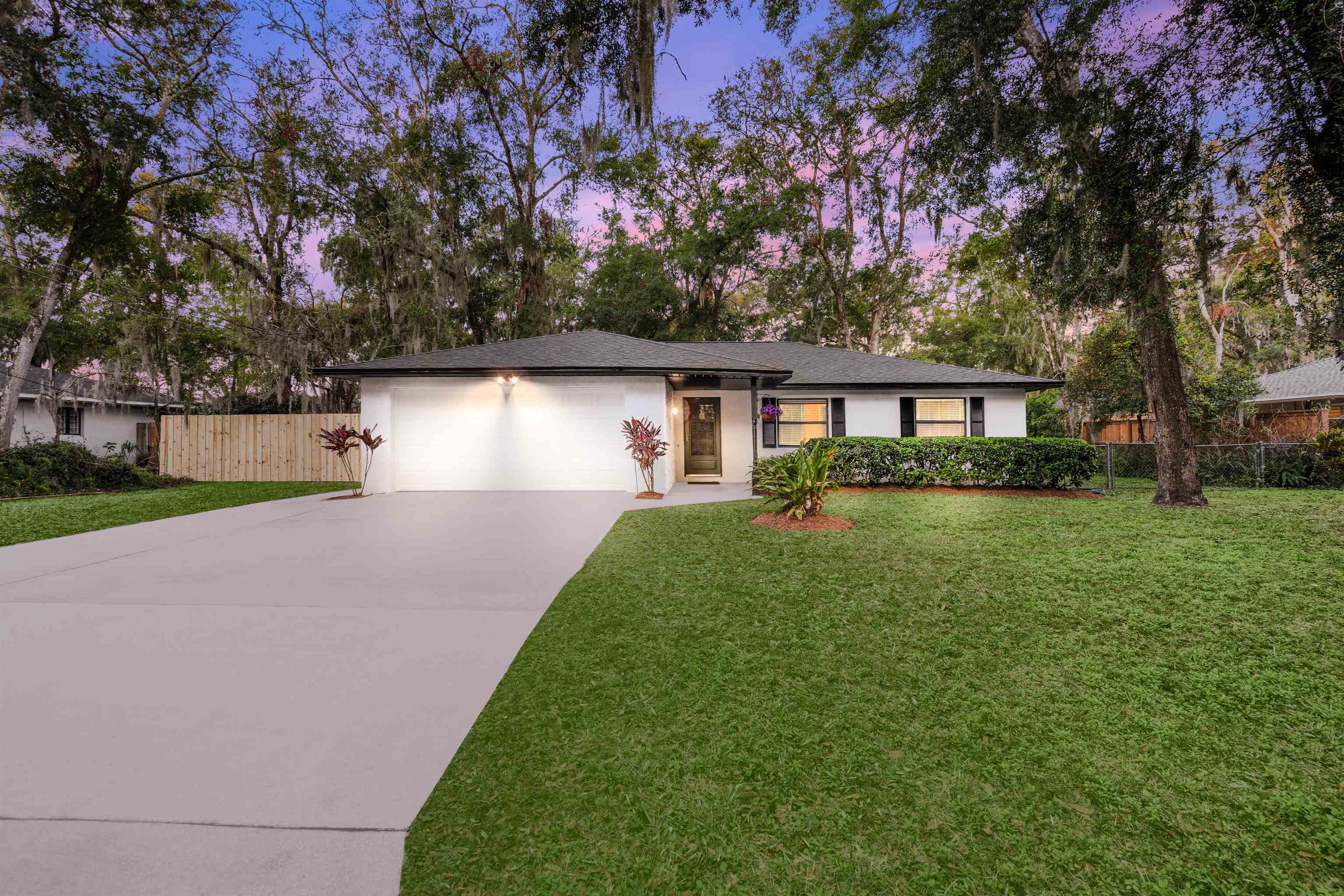 176 Linden Road St. Augustine, FL 32086 - Photo 1 of 50 a front view of a house with garden