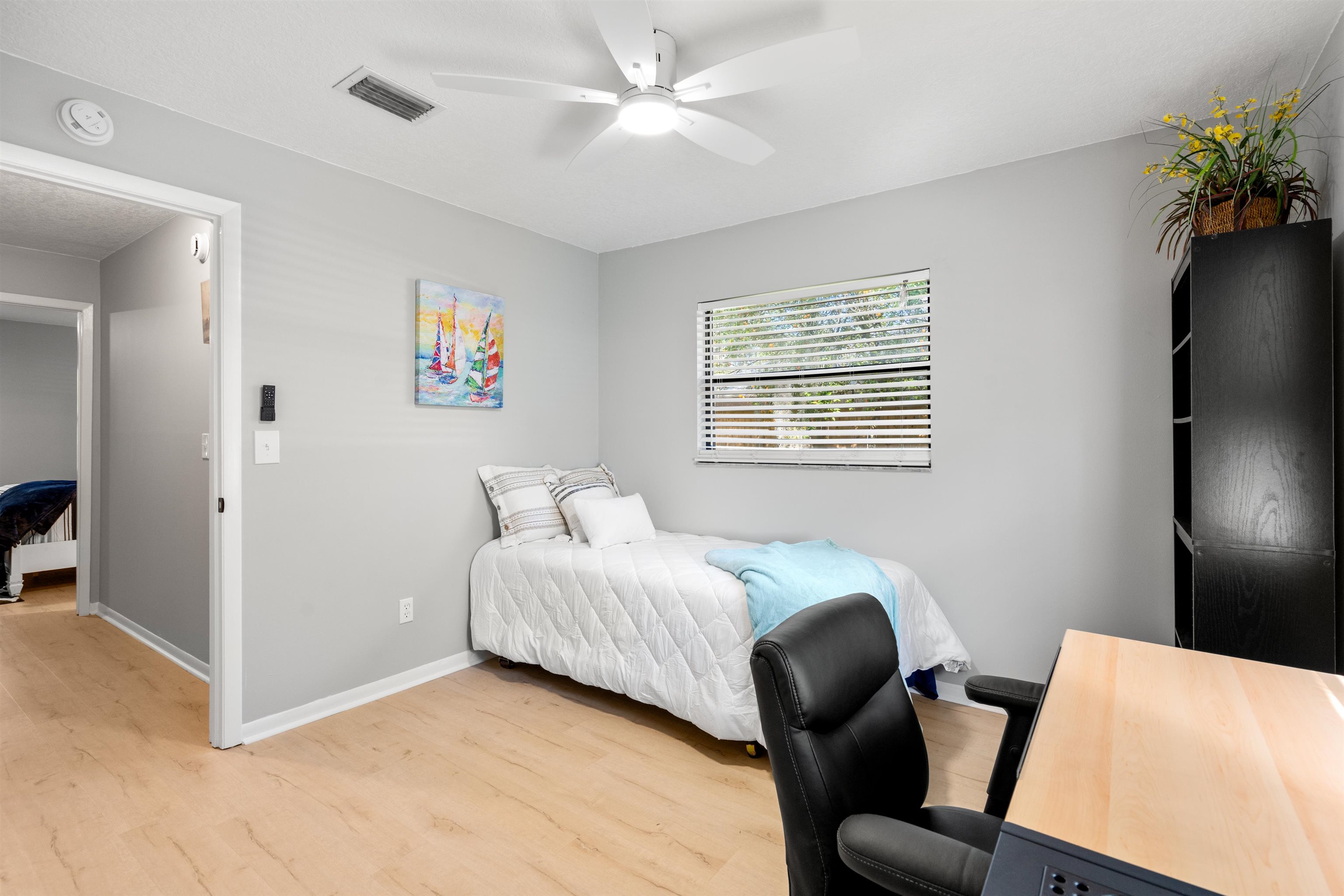 176 Linden Road St. Augustine, FL 32086 - Photo 20 of 50 a bedroom with a bed and a chair