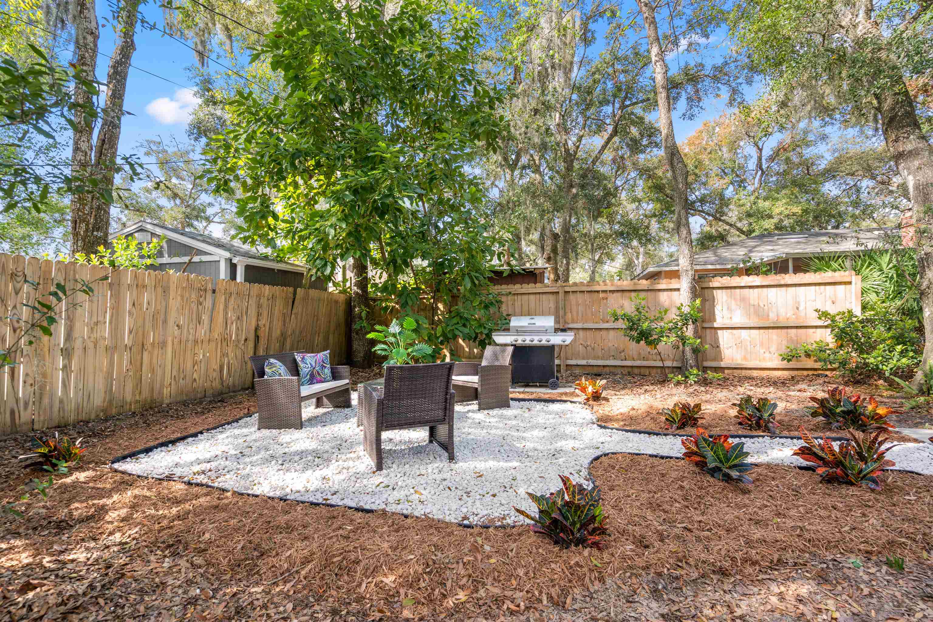 176 Linden Road St. Augustine, FL 32086 - Photo 33 of 50 a view of backyard with outdoor seating and trees