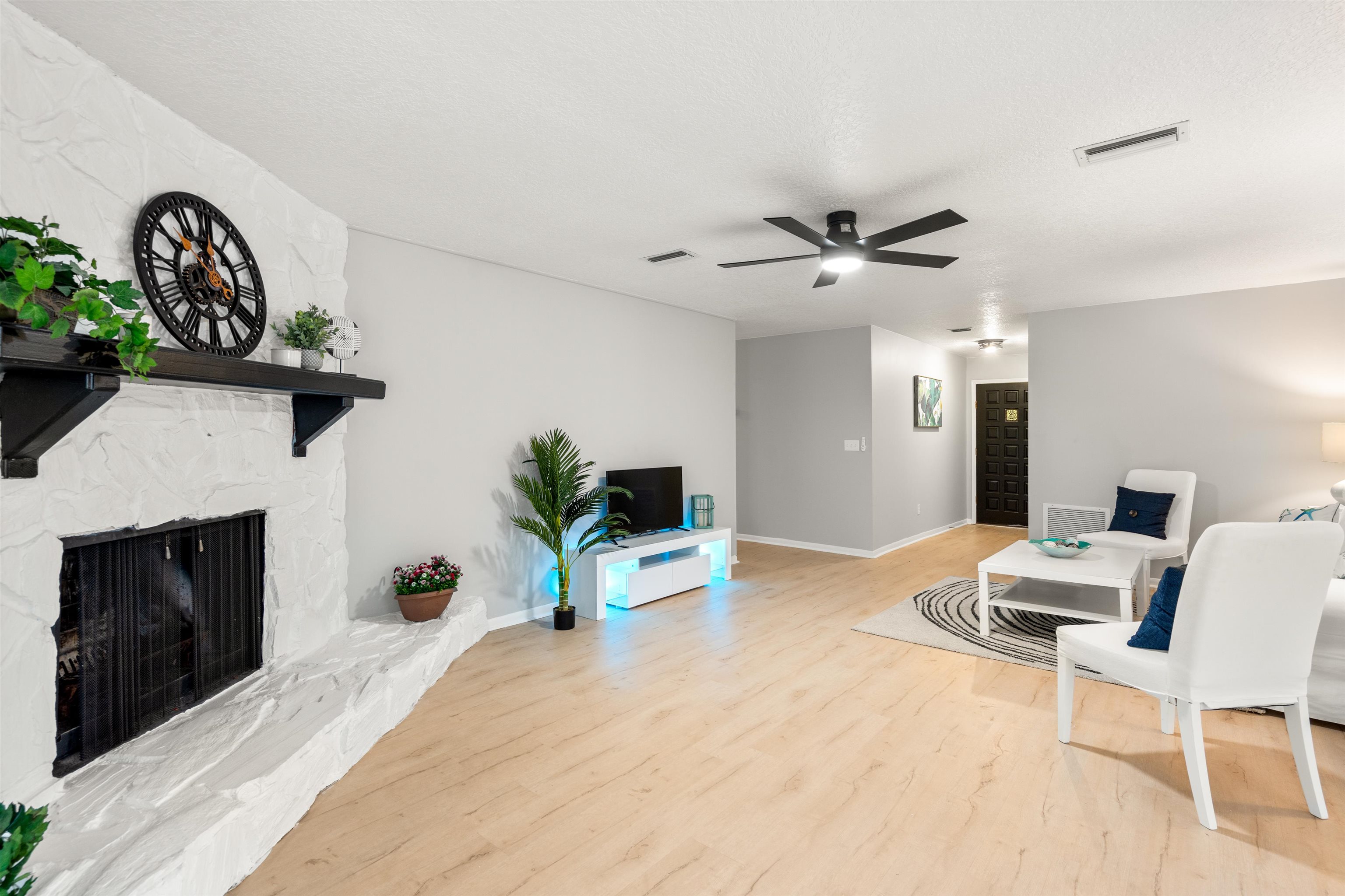 176 Linden Road St. Augustine, FL 32086 - Photo 8 of 50 a living room with furniture and a fireplace