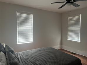 1327 Liverpool Street, Unit 1 Pittsburgh, PA 15233 - Photo 17 of 24 a bedroom with a bed and a window